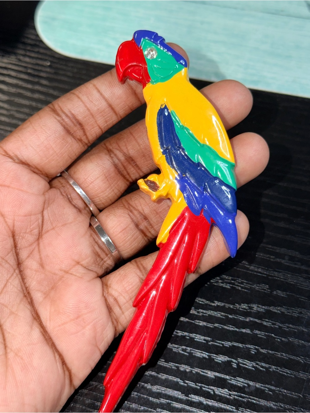 lovely carved parrot brooch , hand painted great wearable condition